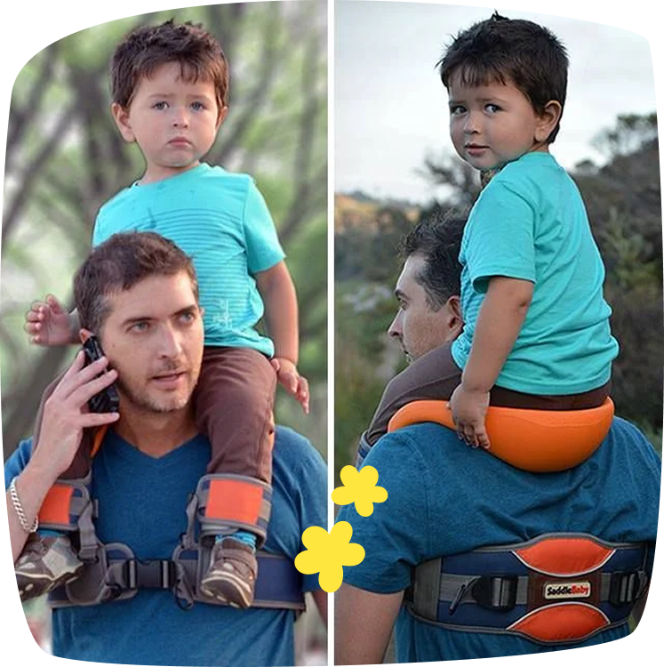 Padre lleva a su hijo sobre los hombros con el portabebés SaddleBaby durante un paseo