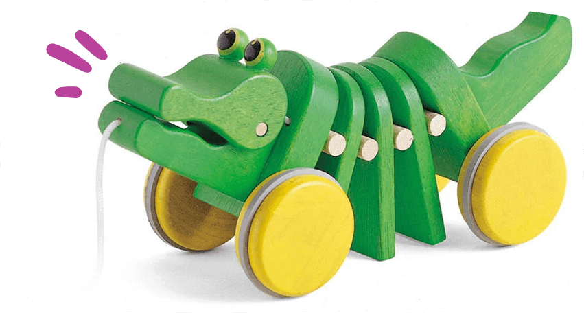 Cocodrilo verde de madera con ruedas amarillas y cuerda para arrastrar, diseñado como juguete para primeros pasos.